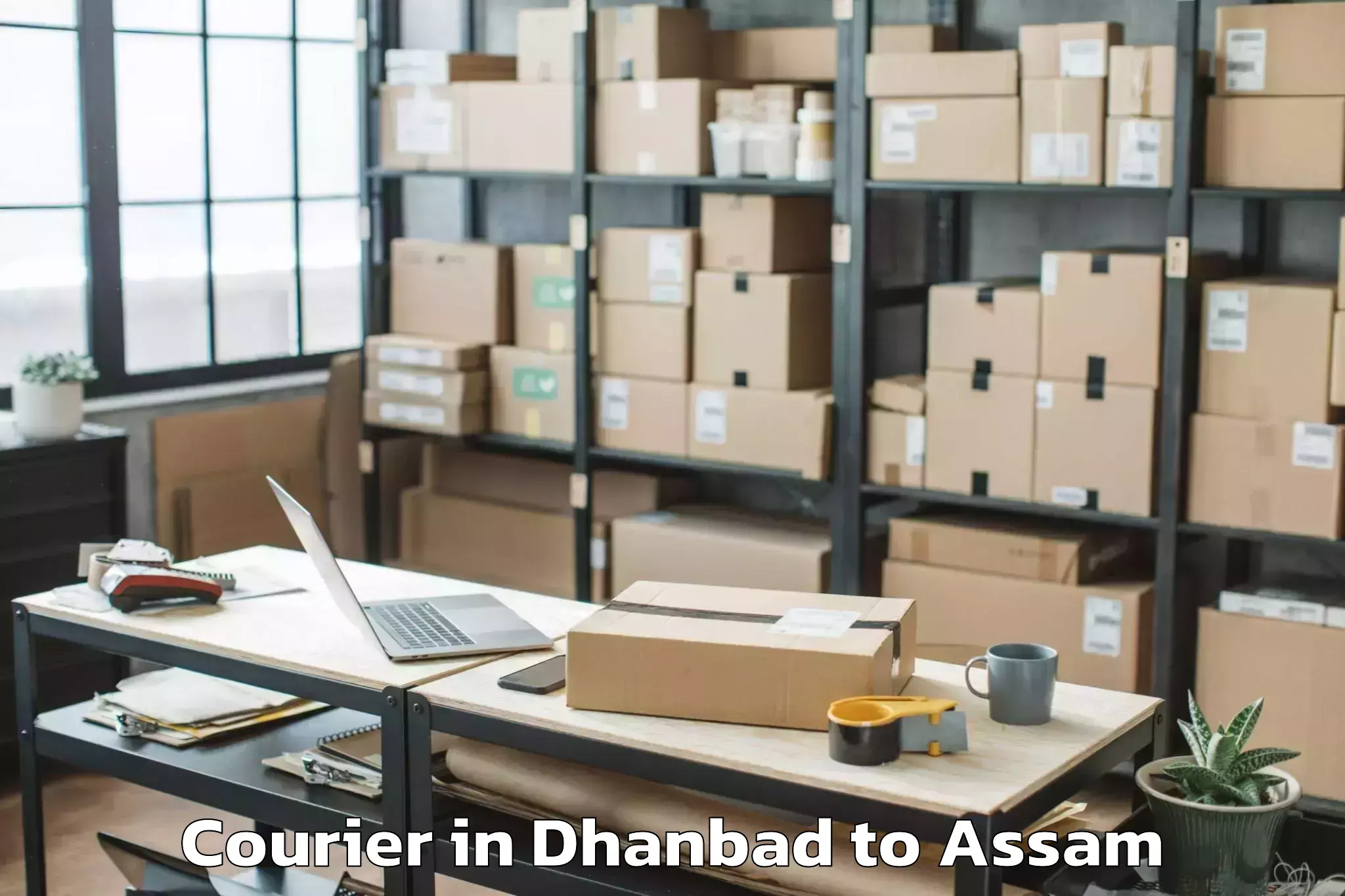 Easy Dhanbad to Borjhar Airport Gau Courier Booking